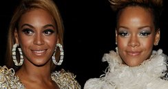 Beyonce Knowles (L) and Rihanna (R) backstage duri