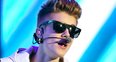 Justin Bieber shows off new owl tattoo on stage