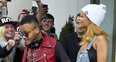 Rihanna holding hands with her brother