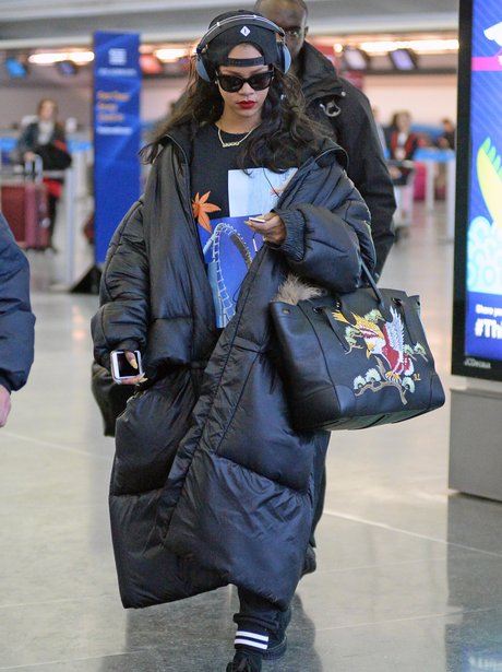 That's what you call a winter coat! Rihanna wraps up in a giant puffer ...